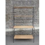 A contemporary Sia collection steel framed floor standing and folding shelving unit with partially