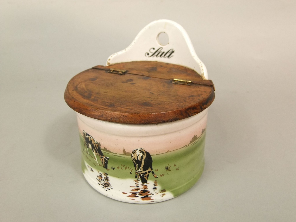 An early 20th century ceramic wall hanging salt crock with printed decoration of cattle with