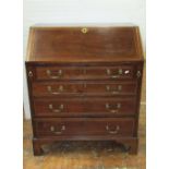 A small Regency mahogany bureau of four long graduated drawers, with chequered string inlay, the