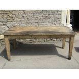 19th century pine farmhouse kitchen table, the rectangular top raised on four square tapered and