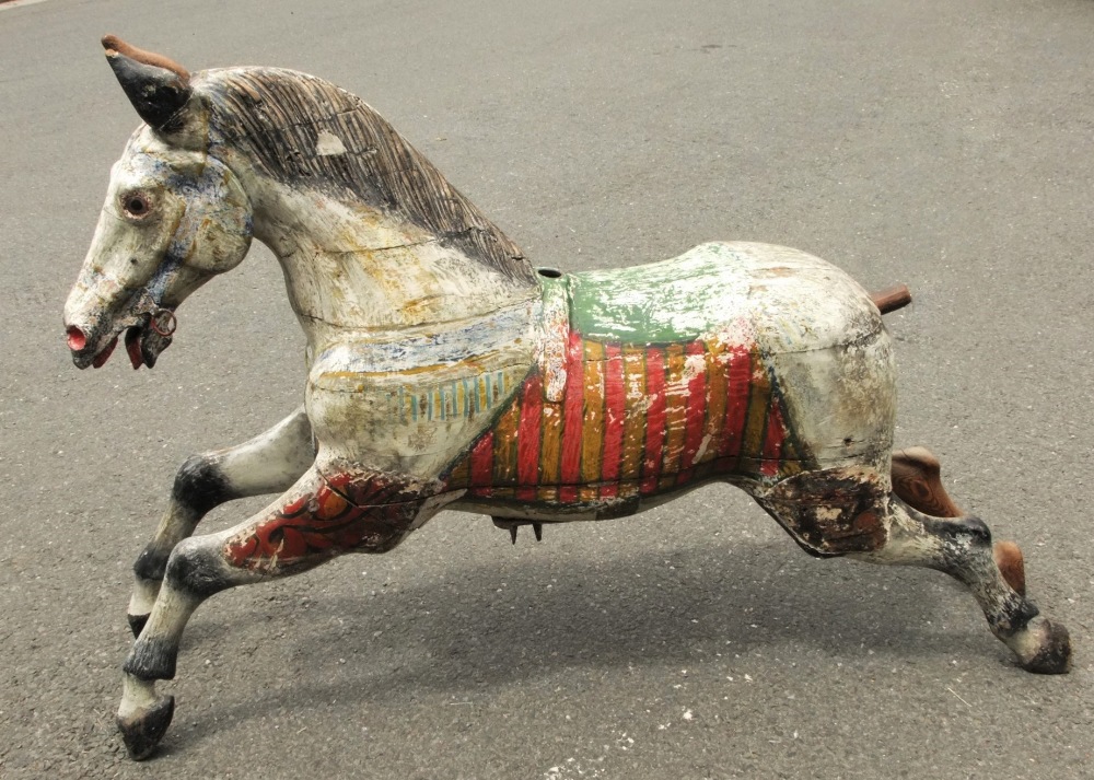 Early English (circa 1860) fairground carousel horse, the jointed wooden body with carved detail