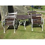 A set of four good quality garden chairs in the Coalbrookdale style with stained wooden slatted