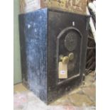 Thomas Perry & Sons patent fire resisting safe, enclosed by single arched moulded panel door, with