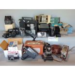 Three boxes of various optical and camera equipment to include various cameras and lenses