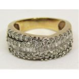 9ct diamond crossover type ring set with baguette and round cut diamonds, size K/L, 4.6g