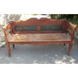 A European red stained pine bench/low settle with shaped outline, panelled back, solid seat and open