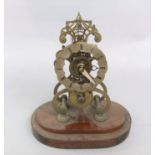 A 19th century brass single fusee skeleton clock, raised on a mahogany plinth, 28cm high overall