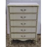 A decorative reproduction white painted and gilt lined bedroom chest with serpentine moulded outline