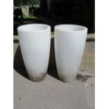 A pair of contemporary white moulded plastic (to simulate marble) planters of circular tapered form,