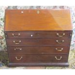 A Georgian mahogany bureau of four long graduated drawers, the fall flap enclosing a fitted interior