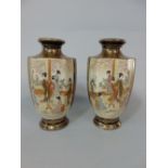 A pair of early 20th century Satsuma vases of hexagonal form with painted and gilded wisteria and