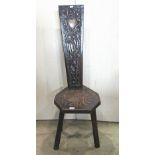 A Victorian oak spinning chair with carved and pierced detail