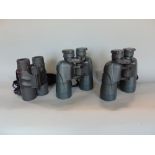 Three pairs of binoculars to include Yukon 12 x 50 and 16 x 50 and Tasco roof prism 8 x 42, all with