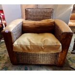 A pair of good quality drawing room chairs in an Art Deco style, the wicker frameworks finished with