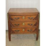 A small oak and stained beechwood chest of three long drawers with fixed cast metal handles and