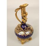 An unusual 19th century blue ground ewer with slender neck, gilded scrolling detail and ornate