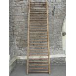 A rustic 19th century pine framed agricultural manger the ladder shaped rail, with through jointed