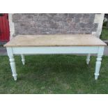 A Victorian pine scrub top farmhouse kitchen table of rectangular form, raised on four turned and