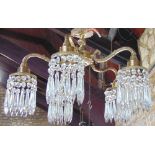 Early 20th century cast gilt brass five branch electrolier all with prismatic glass drop sconces