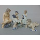 A collection of Royal Copenhagen figures comprising a seated girl knitting 1314, a crawling baby