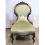 A Victorian ladies drawing room/nursing chair with upholstered seat and back within a shaped