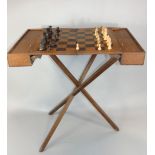Campaign type chess set on a folding stand with four lidded games compartments and
