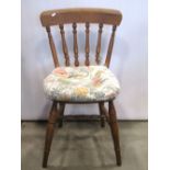A set of five Windsor elm and beechwood kitchen chairs with turned spindle backs, raised on turned