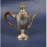 George III silver hot water pot, the lid revealing a fitted interior with a coat of arms crest,