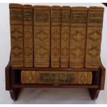 An Asprey & Co Reference Library in a mahogany rest with an Asprey's stamp to the back, containing