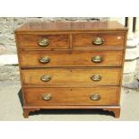 A Regency mahogany chest of three long and two short drawers with string banded inlay raised on