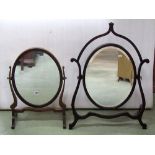 Four 19th century and later toilet mirrors of varying design, two with skeleton frames, a triple