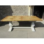 A good quality oak refectory table, the rectangular geometric patterned top raised on a painted base