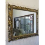 A 19th century gilt wood wall mirror of rectangular form, with pierced scrolling acanthus frame,