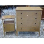 A mid 20th century oak veneered bedroom chest of four long drawers, raised on tapered and moulded