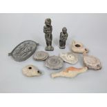 A collection of archaic finds to include two hardstone carvings, one of a gentleman and female