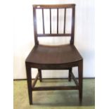 A set of four Georgian fruitwood country made dining chairs with reeded stick backs over solid