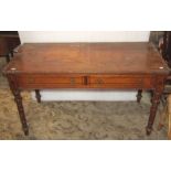 A Victorian Gothic revival side table with painted simulated inlaid detail, two frieze drawers and