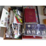 A collection of approximately 40 Royal Mail Mint Stamp packets, three stock books containing a