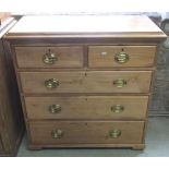A late Victorian stripped and waxed pine bedroom chest of two short over three long graduated
