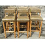 A set of six bar stools, with soft stitched sage green leather upholstered seats and back rails,