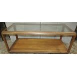A retro teak two tier coffee table of rectangular form with inset glass top, 112cm long x 54cm