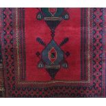 Iranian full pile Baluchi tribal rug, red ground, 200 x 105cm