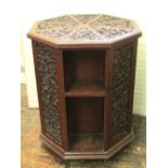 A good quality 19th century teakwood revolving bookcase of octagonal form with alternating open