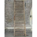 A rustic 19th century pine framed agricultural manger the ladder shaped rail, with through jointed