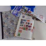 Two stamp albums containing a quantity of British & Worldwide stamps, together with further loose