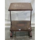 An unusual arts and crafts style two tier occasional table, with oak framed hammered copper