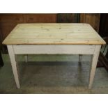 19th century pine scrubbed top kitchen table of rectangular form, with cleated ends over a frieze