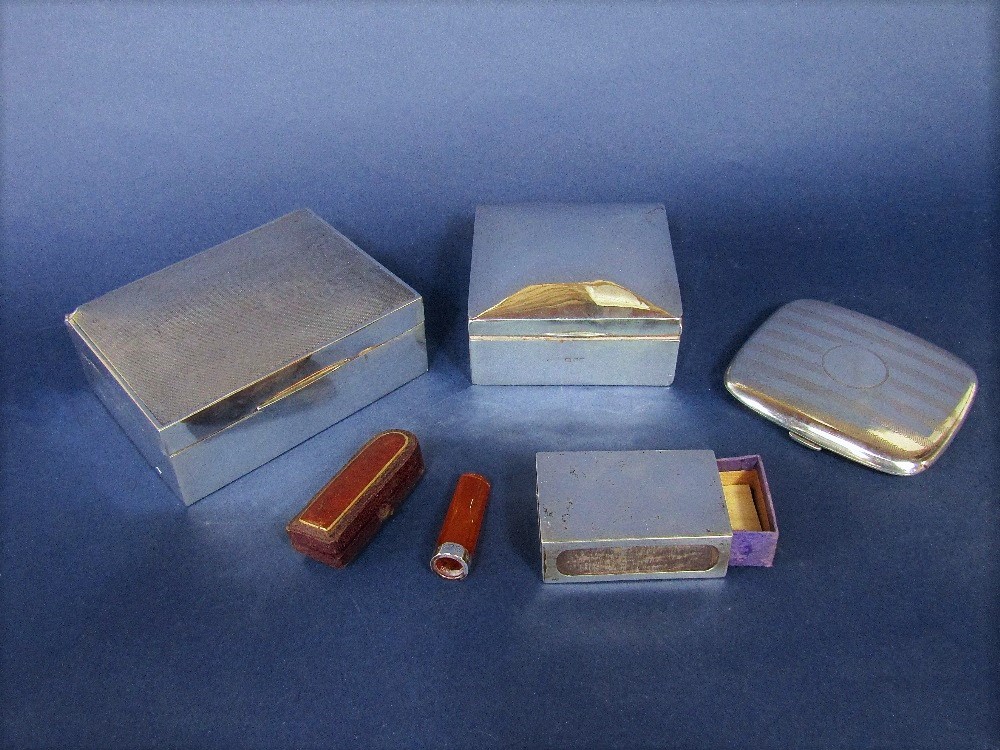 A collection of smoking related silver to include two silver cigarette boxes, a silver matchbox