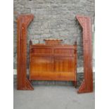 A 19th century stained pine bedstead, the panelled head and foot boards with applied simulated