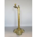 Interesting 19th century sprung brass candlestick with floral sconce, the cylinder column holding